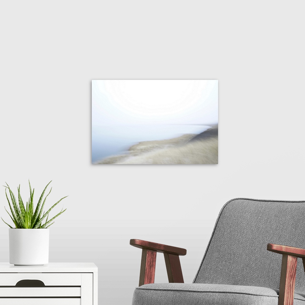 A modern room featuring Artistically blurred photo. A misty morning on the boarders of a lake. It feels like standing on ...
