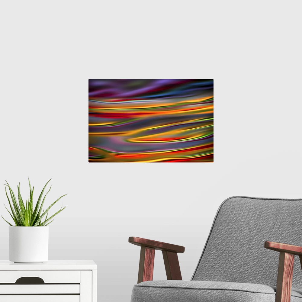 A modern room featuring Abstract photograph with dreamy lines in hues of the rainbow.