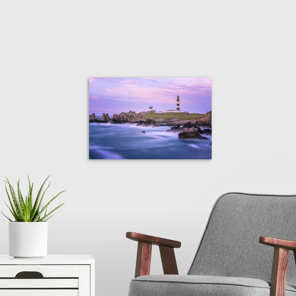A modern room featuring A coastal landscape with a striped lighthouse in the distance.
