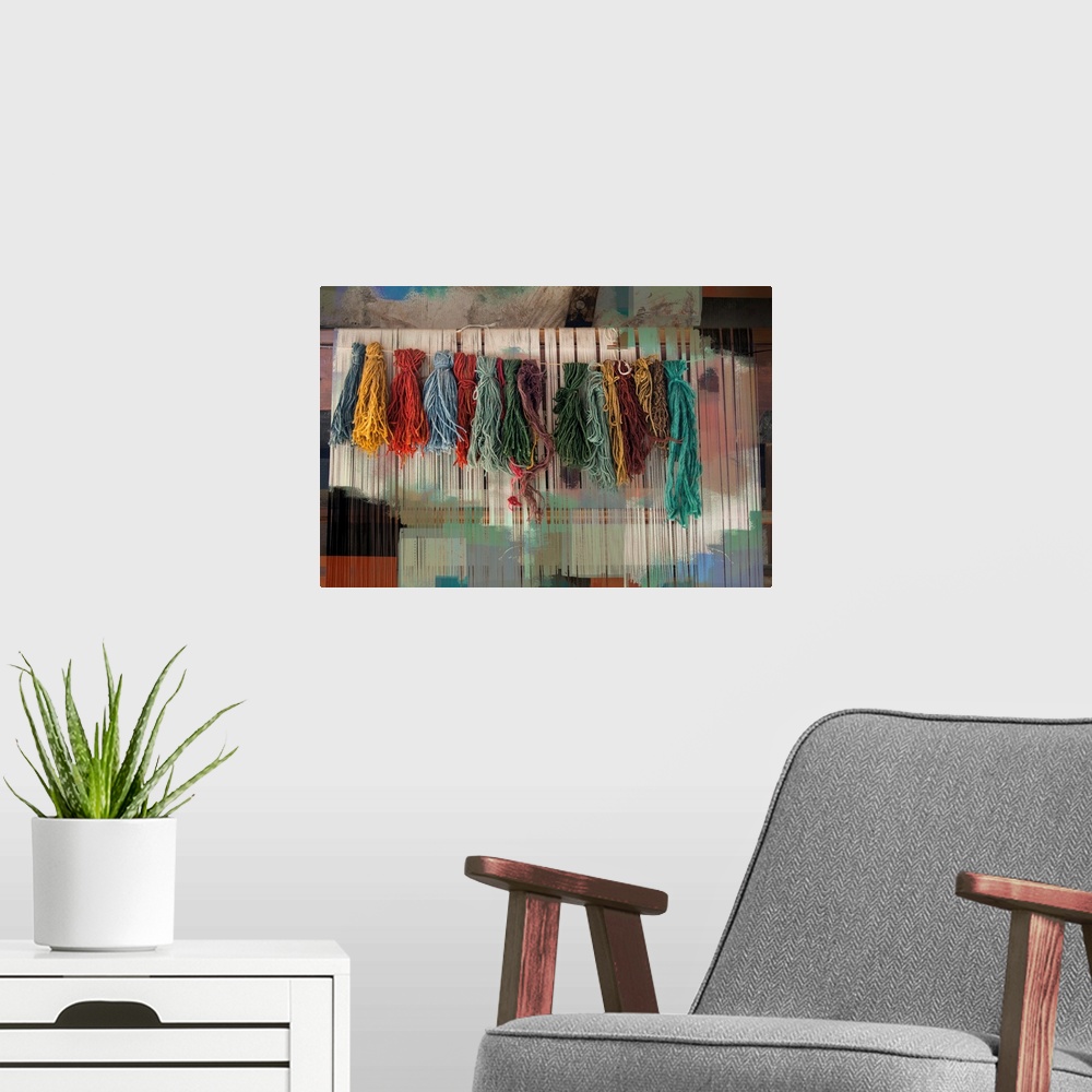 A modern room featuring Photograph of colorful bundles of yarn hanging on a line with an abstract background.