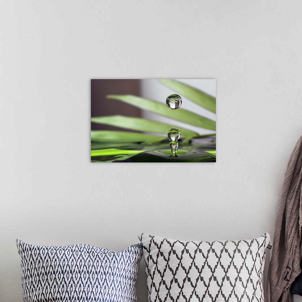 A bohemian room featuring A macro photograph of a water droplet sitting suspended in air against an abstract background.