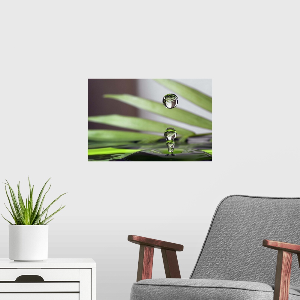 A modern room featuring A macro photograph of a water droplet sitting suspended in air against an abstract background.