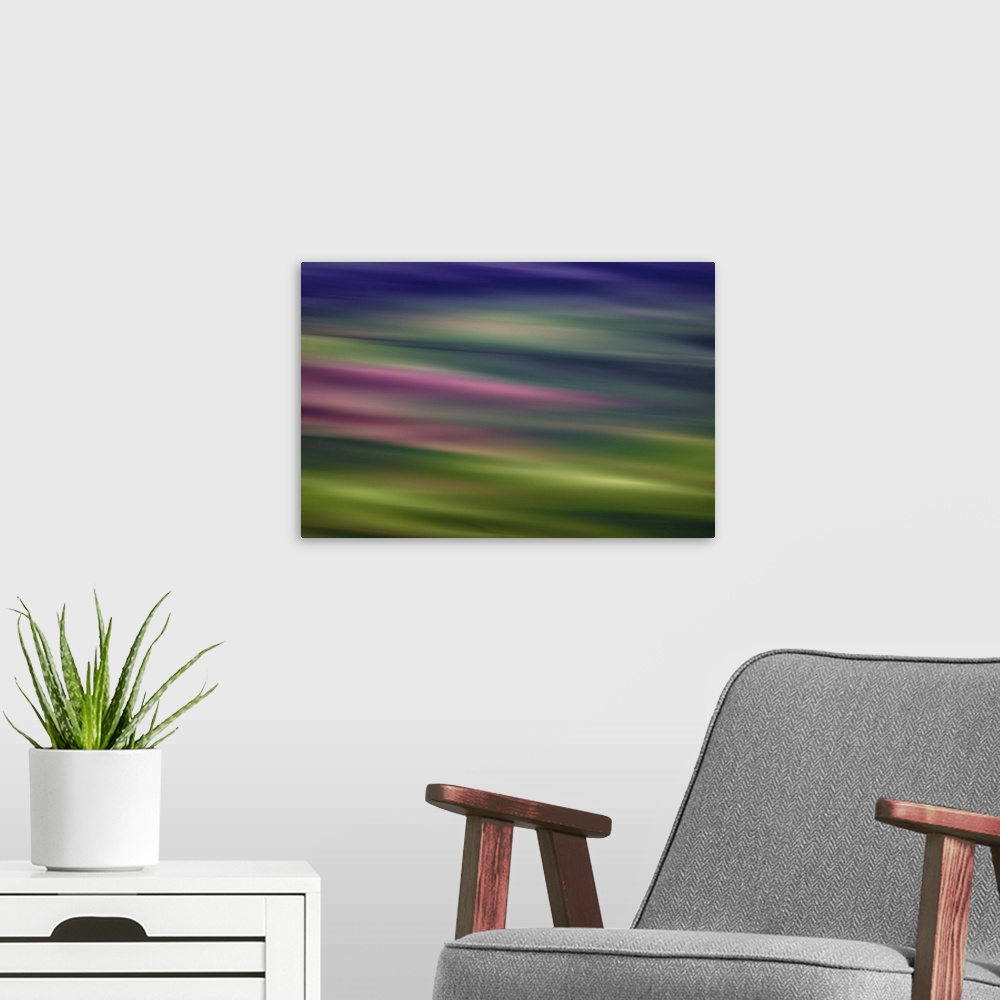 A modern room featuring Long exposure image of the Palouse hills a purple haze.