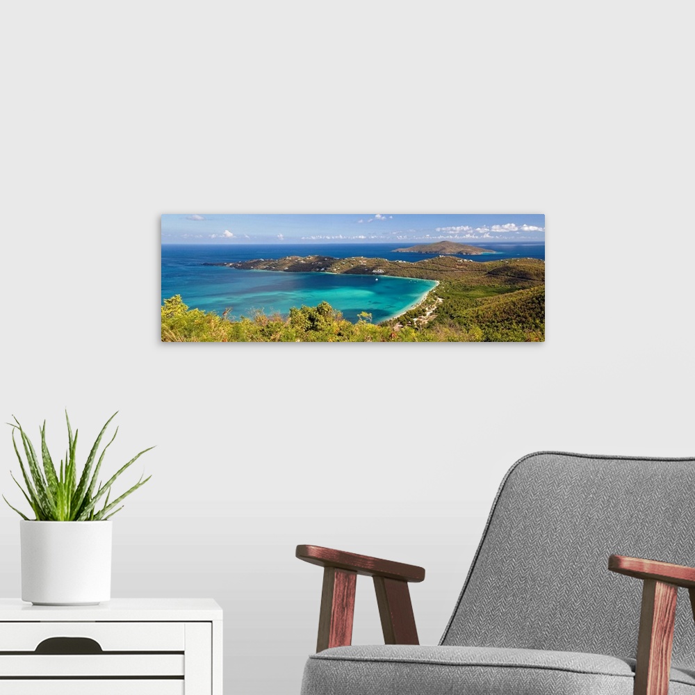 A modern room featuring This panoramic photograph is an aerial shot of a bay in the virgin islands surrounded by large hi...