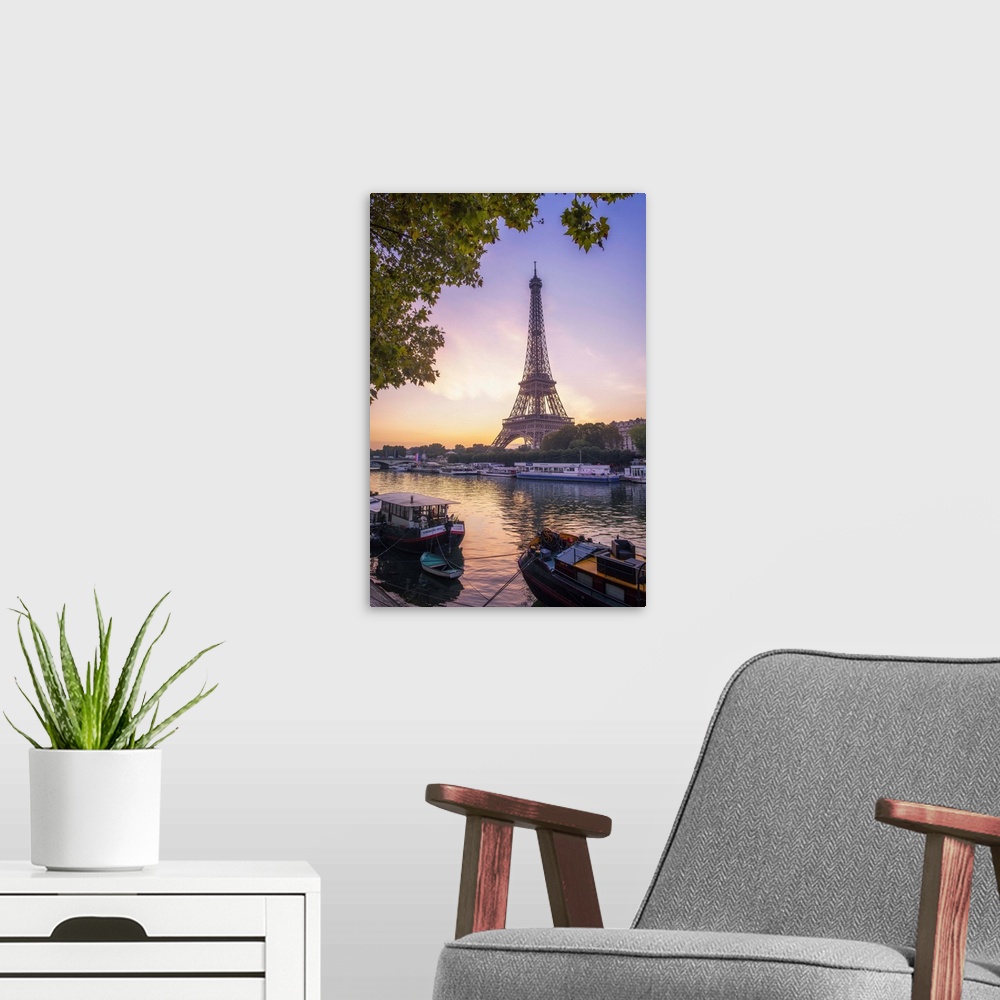 A modern room featuring Sunrise on the Eiffel tower on summer morning in Paris with Peniche boats waiting on the side of ...