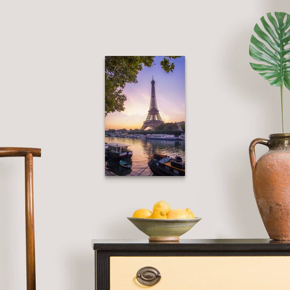 A traditional room featuring Sunrise on the Eiffel tower on summer morning in Paris with Peniche boats waiting on the side of ...