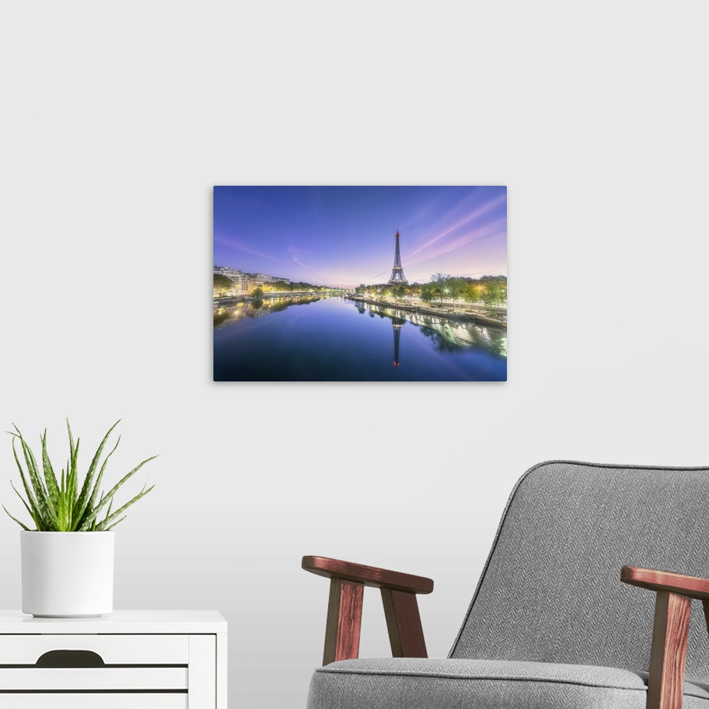 A modern room featuring Sunrise on a summer morning in Paris, view of the Seine with Eiffel tower, boats, buildings and L...