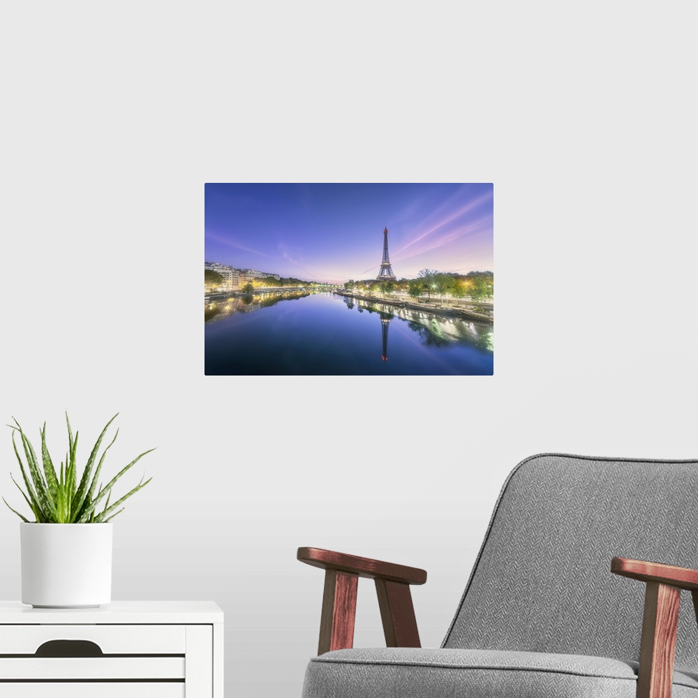 A modern room featuring Sunrise on a summer morning in Paris, view of the Seine with Eiffel tower, boats, buildings and L...