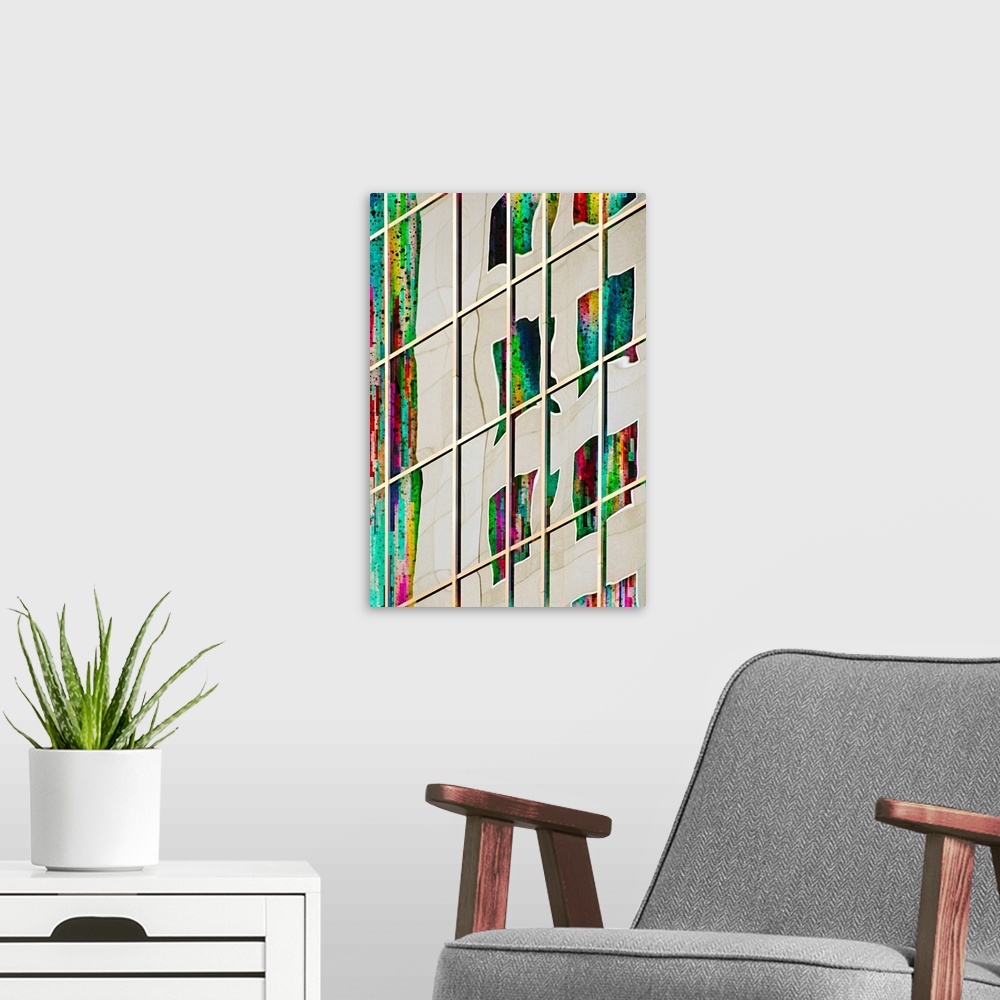 A modern room featuring Abstract photograph of a warped image of colorful windows, reflected in the side of a skyscraper.