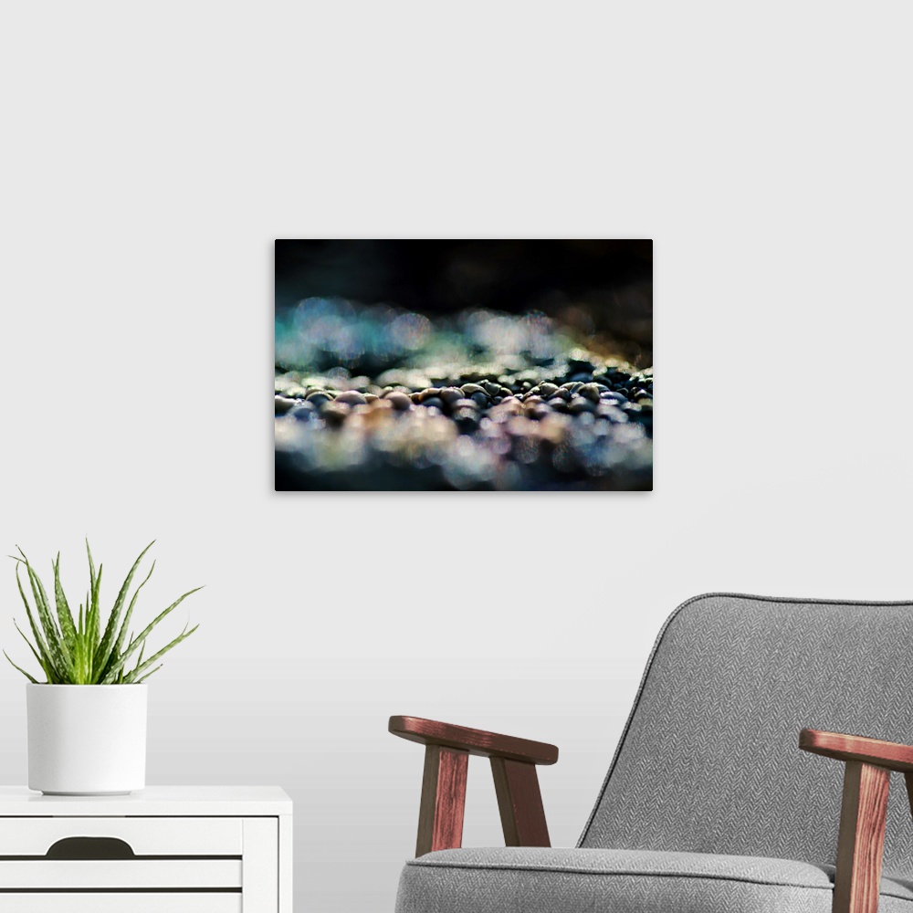 A modern room featuring A photo of pebbles that have been blurred in the foreground and background.