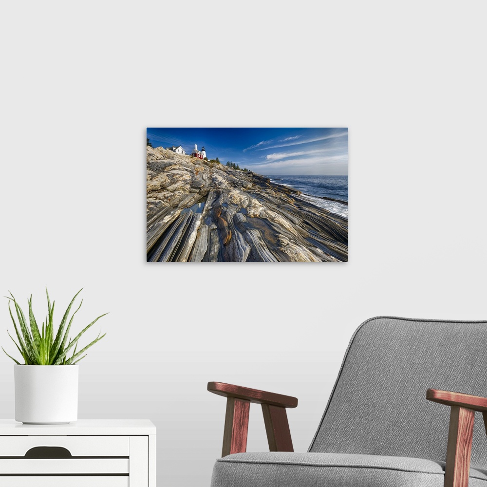 A modern room featuring Low Angle View of a Rocky Shoreline with a Lighthouse, Pemaquid Point, Maine.