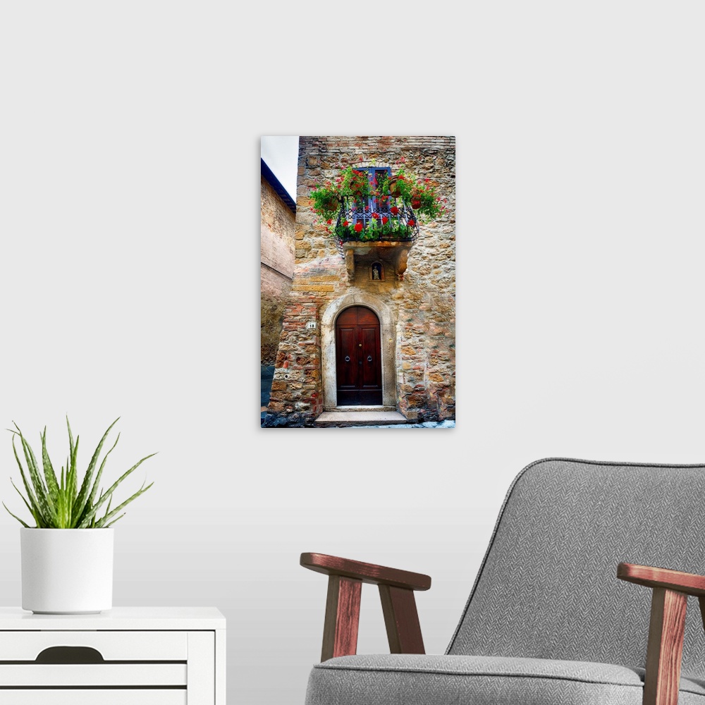 A modern room featuring A photograph of the outside of a door and balcony in Italy.