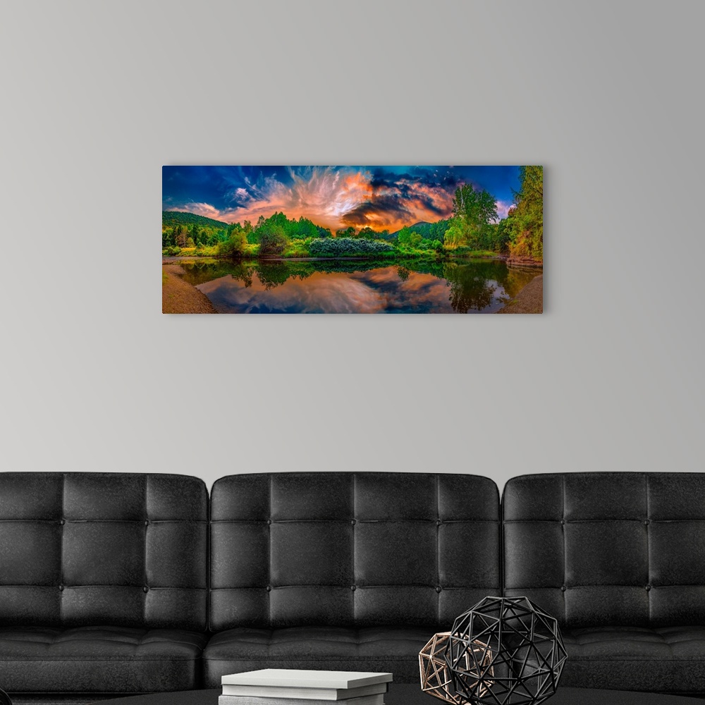 A modern room featuring Stunning sunrise over a lush green river valley.