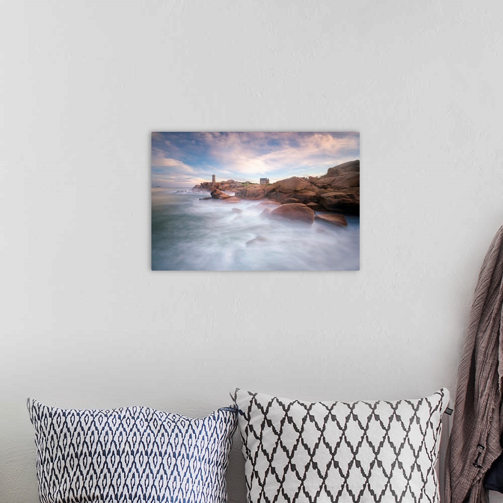 A bohemian room featuring Fine art photo of misty ocean waters at the rocky coast of France with a lighthouse in the distance.