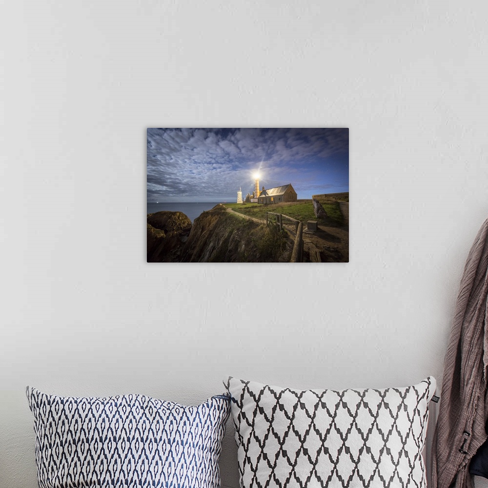 A bohemian room featuring Night shot of Pointe Saint Mathieu lighthouse under the stars.