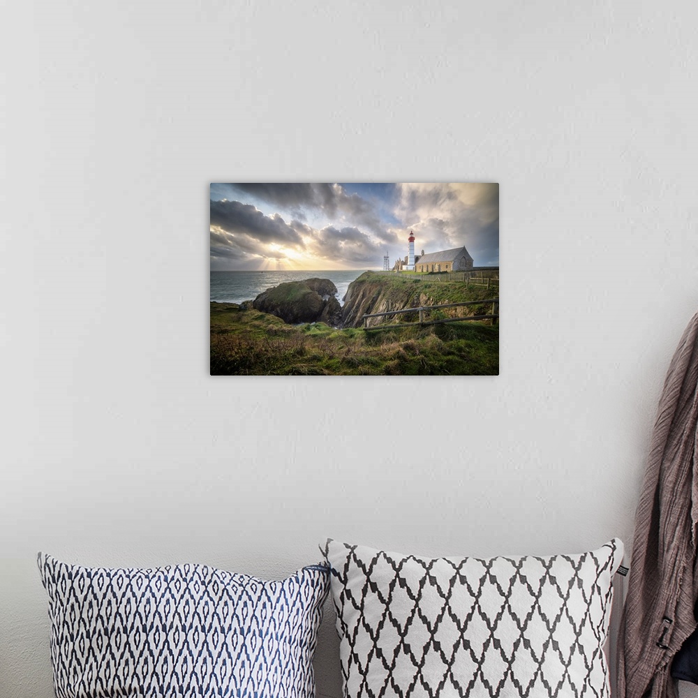 A bohemian room featuring Landscape view of Brittany shoreline called pointe saint mathieu at sunset with rays of light in ...