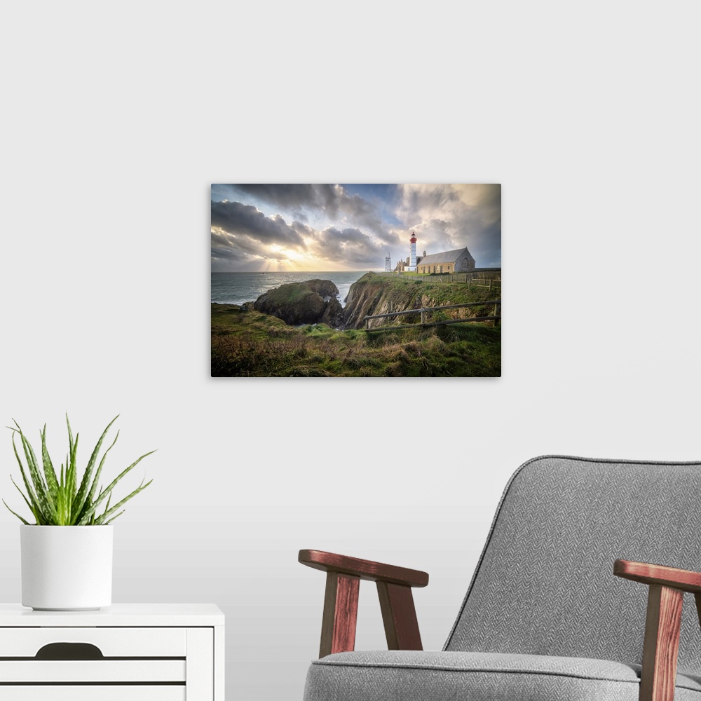 A modern room featuring Landscape view of Brittany shoreline called pointe saint mathieu at sunset with rays of light in ...