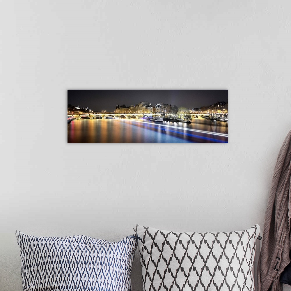 A bohemian room featuring Night long time exposure view of Paris from pont des arts bridge on Seine river with lignting bri...