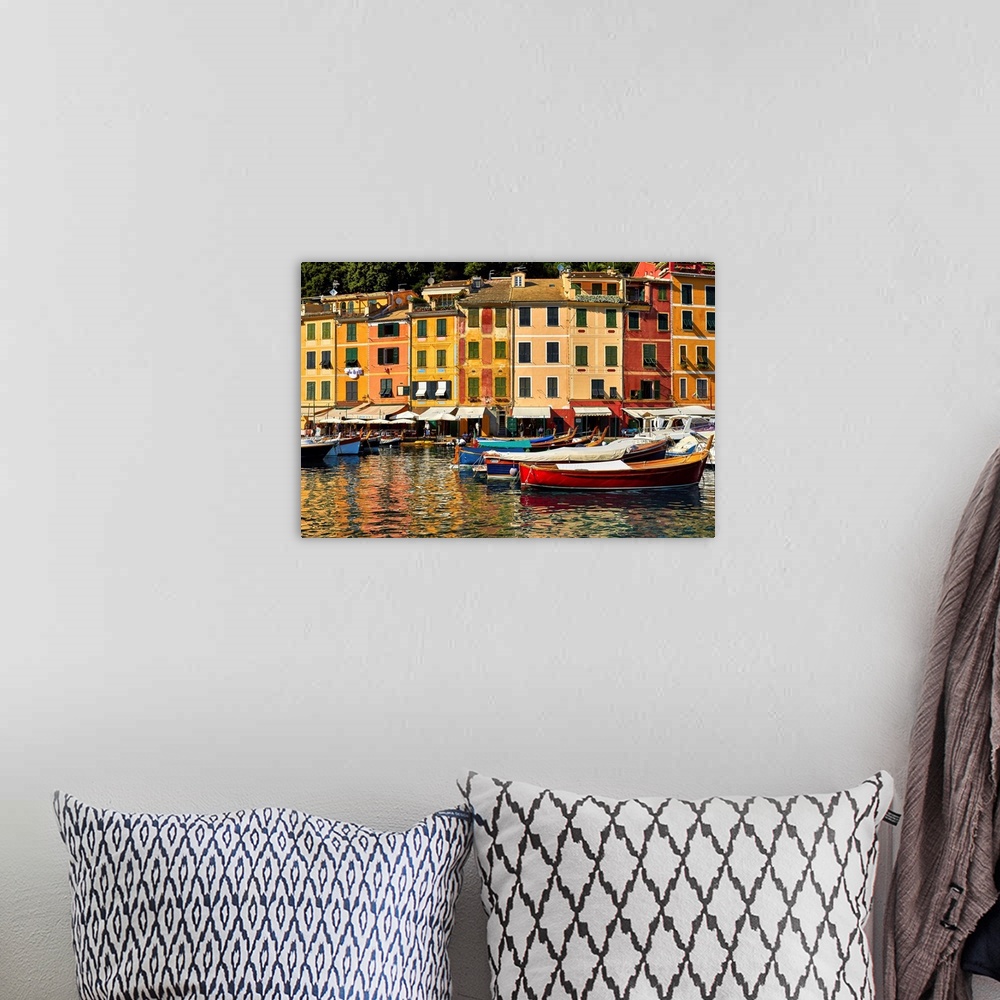 A bohemian room featuring Small boats and colorful old houses in Portofino Harbor, Liguria, Italy.