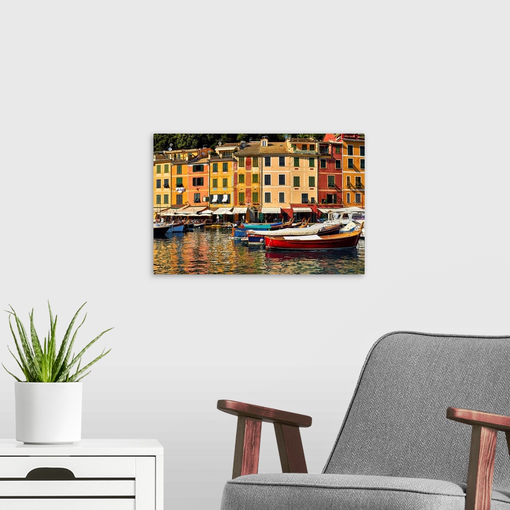 A modern room featuring Small boats and colorful old houses in Portofino Harbor, Liguria, Italy.