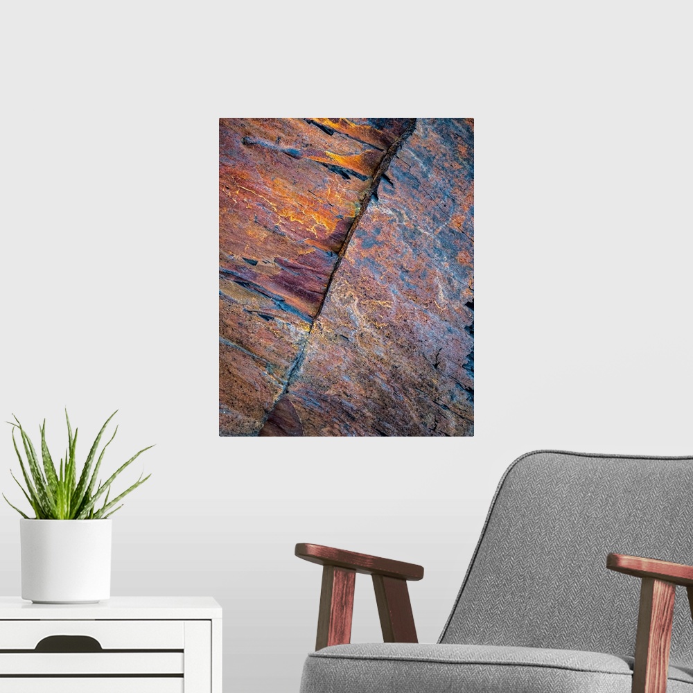 A modern room featuring A contemporary natural abstract of patterns in rock in rich pinks, oranges, blues, golds and purp...
