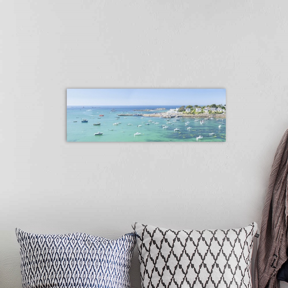 A bohemian room featuring Panoramic landscape photography of Portsall bay in Brittany with boats and emerald sea on a sunny...