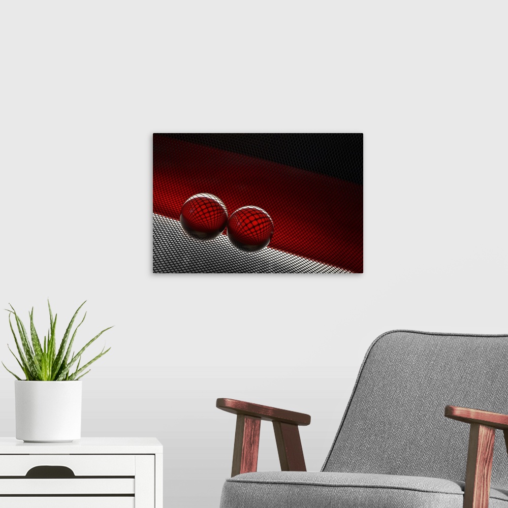 A modern room featuring Two glass spheres reflecting a field of small dots against red.