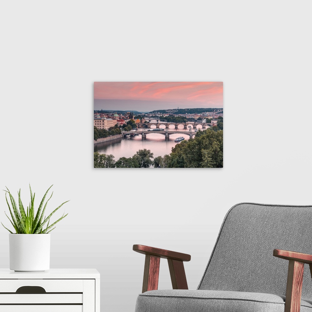 A modern room featuring Bridges over Vltava river in Prague. The middle one is the most famous Charles Bridge, a medieval...