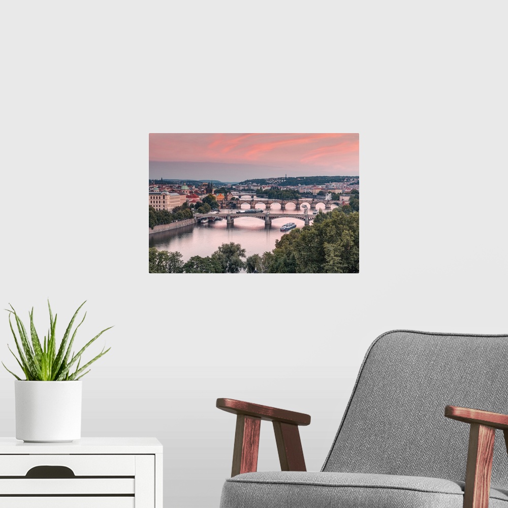 A modern room featuring Bridges over Vltava river in Prague. The middle one is the most famous Charles Bridge, a medieval...