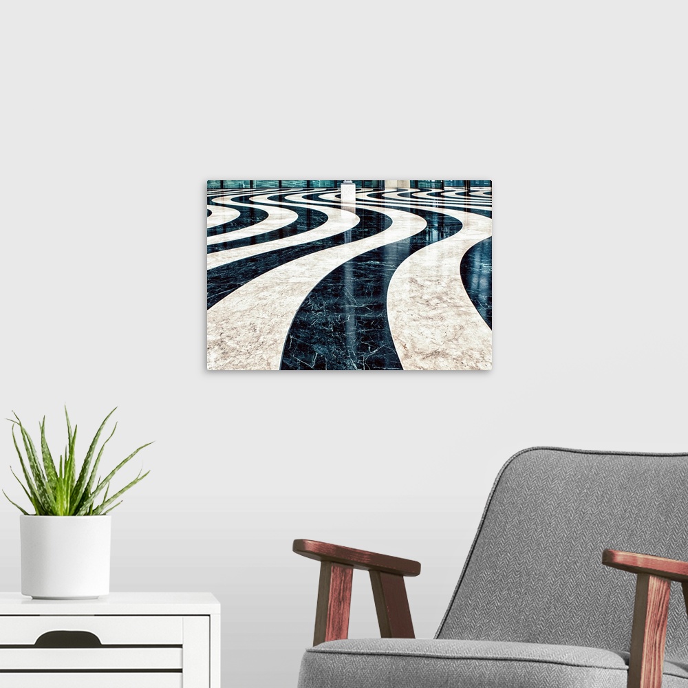 A modern room featuring Fine art photo of a polished floor in a wavy black and white pattern.