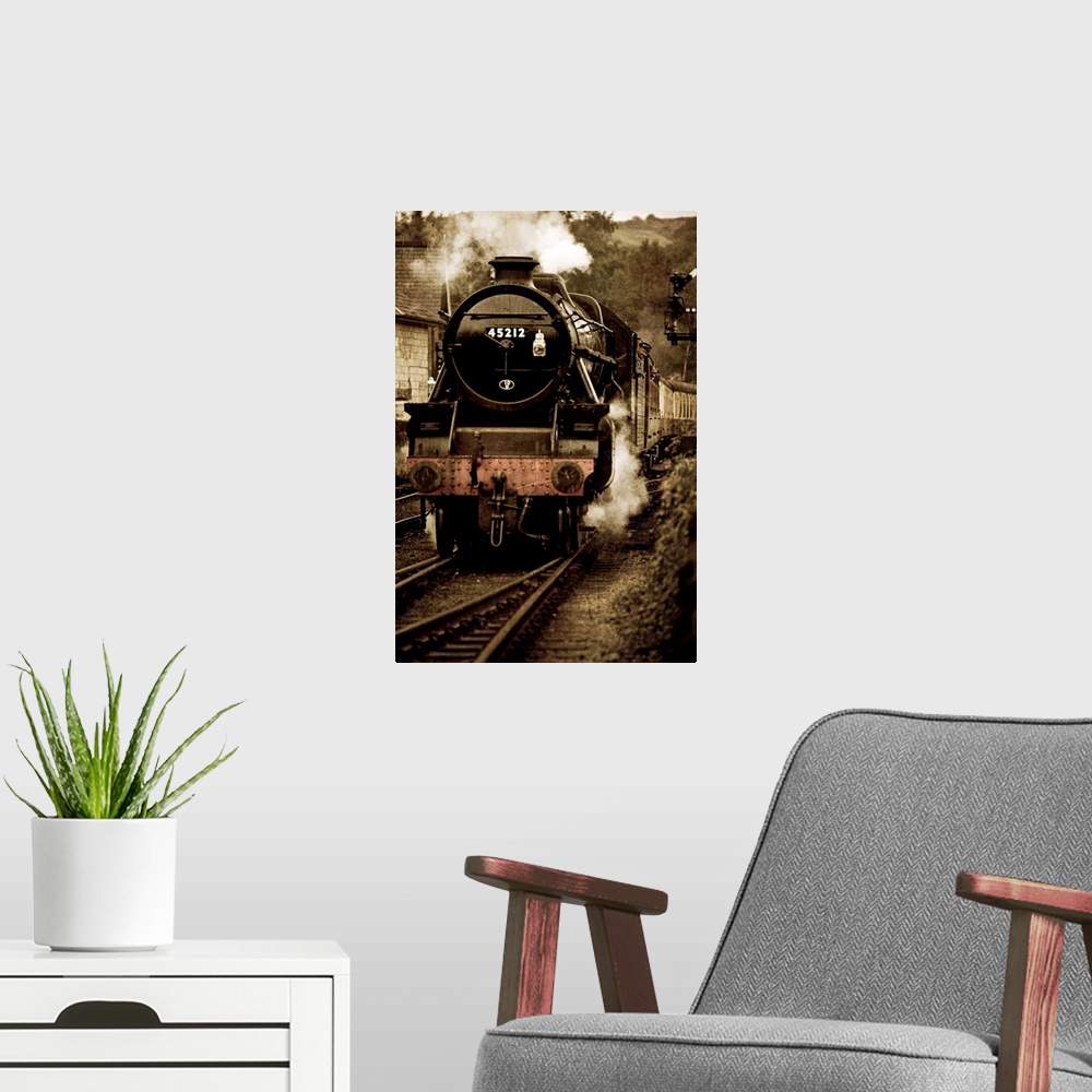 A modern room featuring Photograph of front view of locomotive on tracks blowing smoke and pulling into station, with it'...