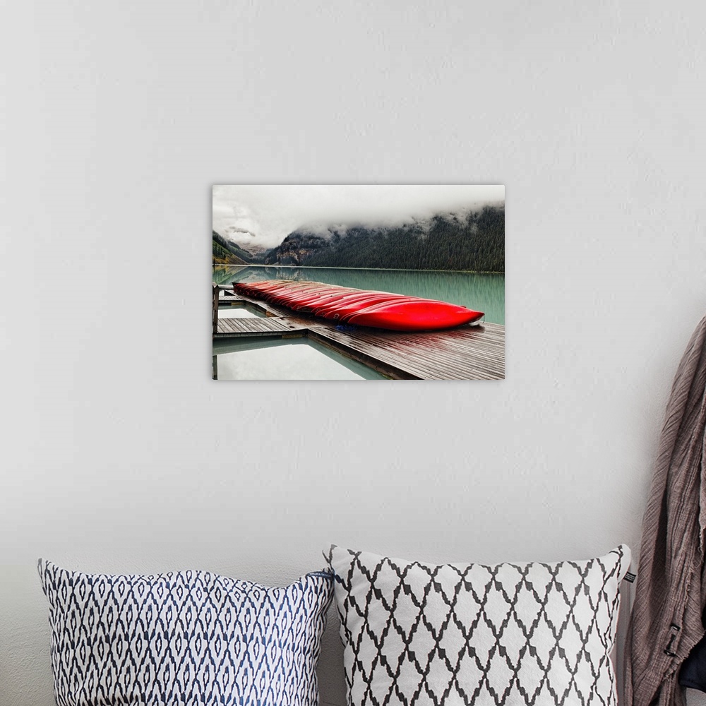 A bohemian room featuring Low Angle View of a Dock with Red Boats, Lake Louise, Alberta, Canada