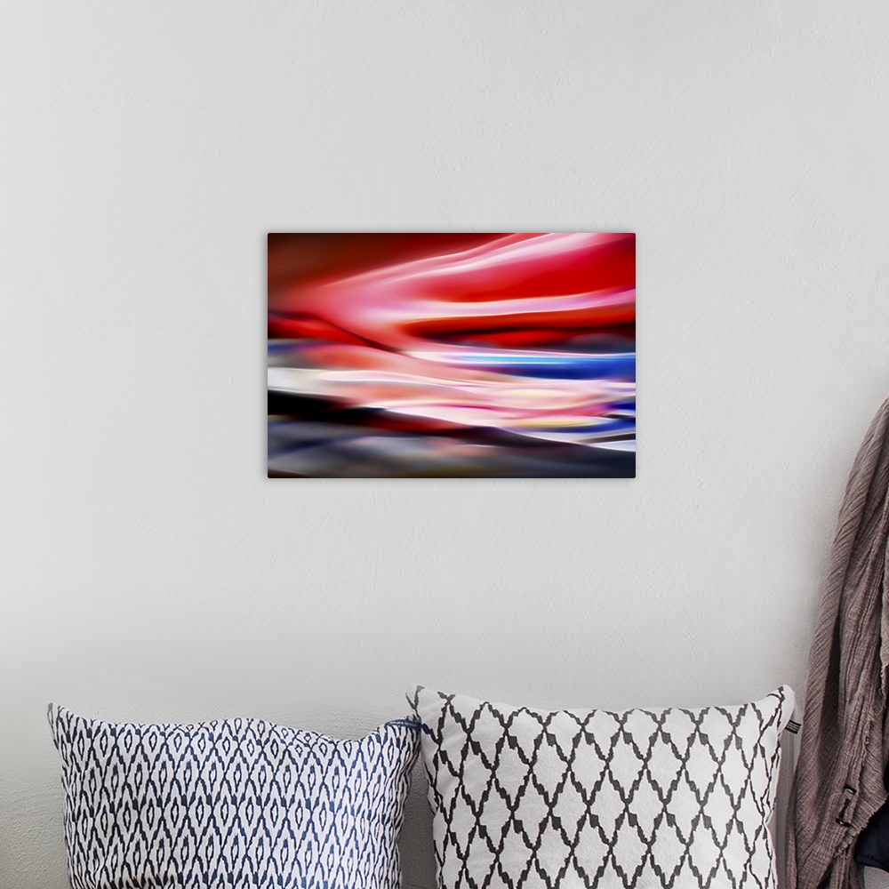 A bohemian room featuring Abstract representation of a very red dawn or sunset.