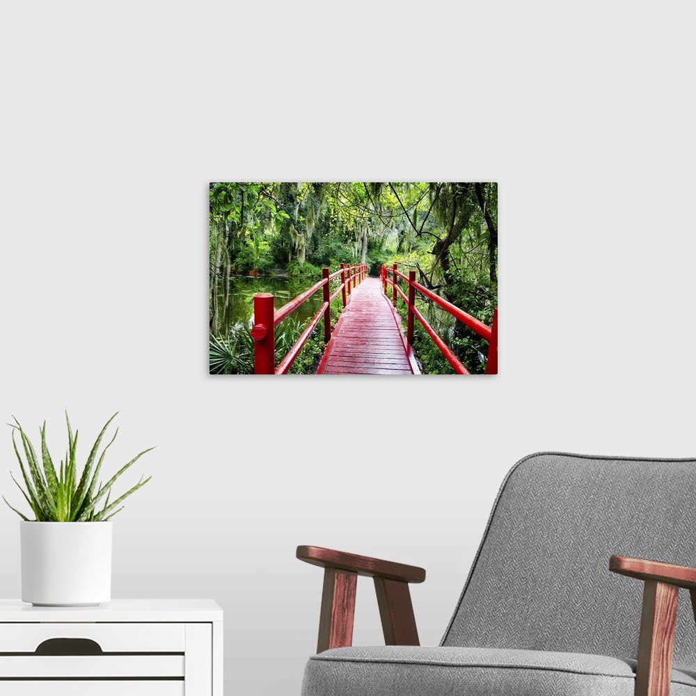 A modern room featuring View of a Red Wooden Footbridge in a Southern Marshy Garden, South Carolina