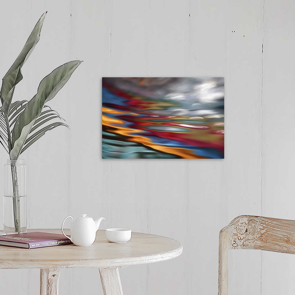 A farmhouse room featuring An abstract photograph of vibrant colors in a wave-like formation.
