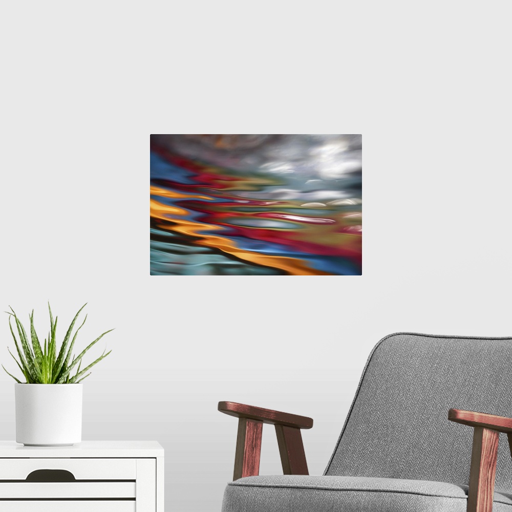A modern room featuring An abstract photograph of vibrant colors in a wave-like formation.