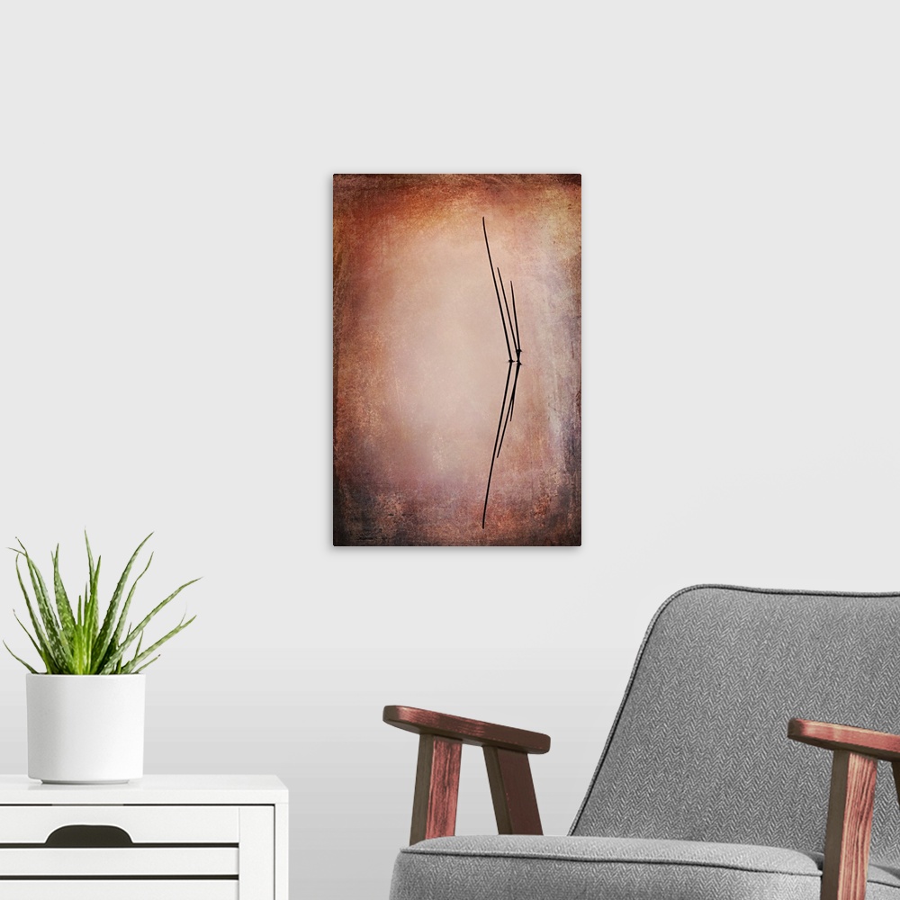 A modern room featuring Photograph of tall, reflecting reeds with a textured background light in the center with a darker...