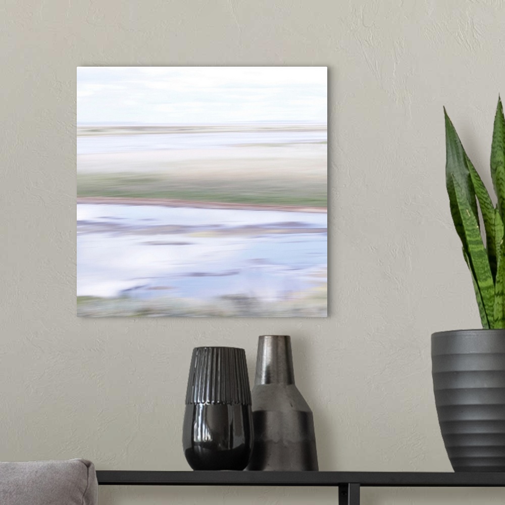 A modern room featuring Artistically blurred photo. A quiet summer afternoon, the water reflects the stillness.
