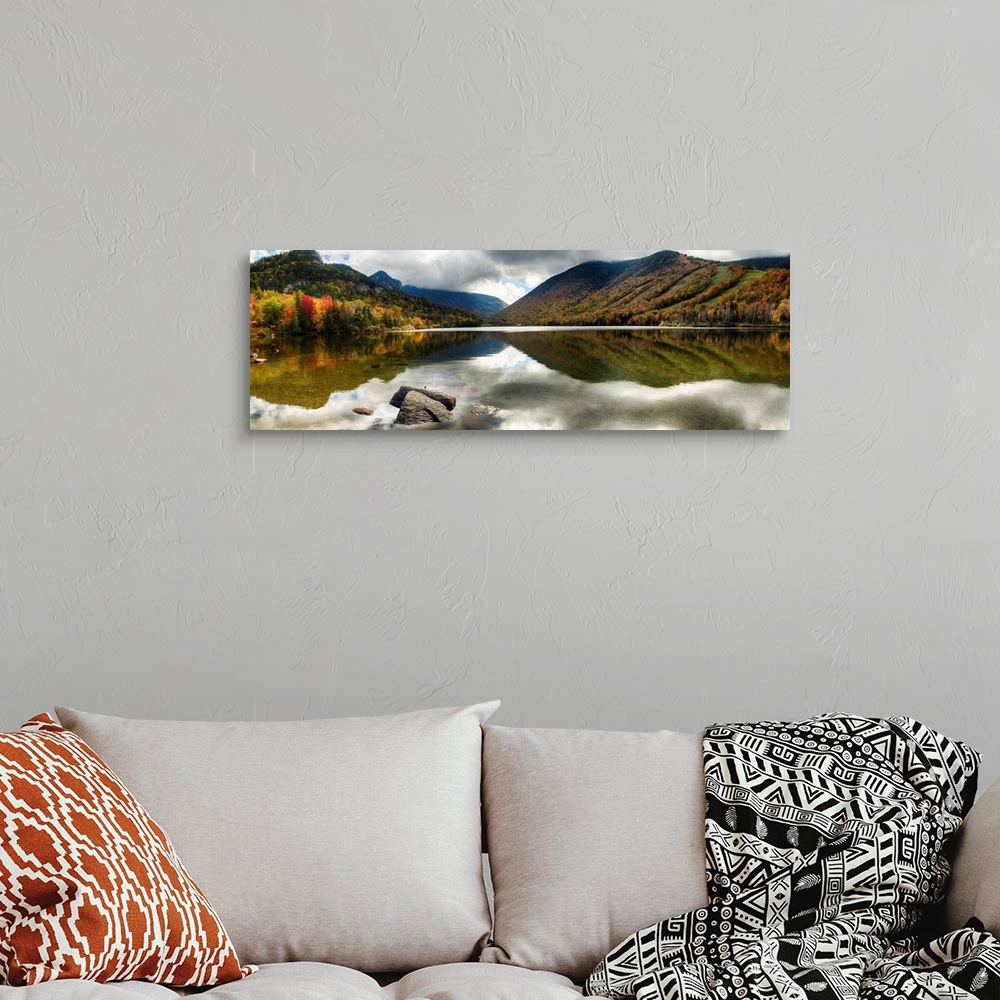 A bohemian room featuring Fine art photo of mountains reflected in a lake in New Hampshire in autumn.