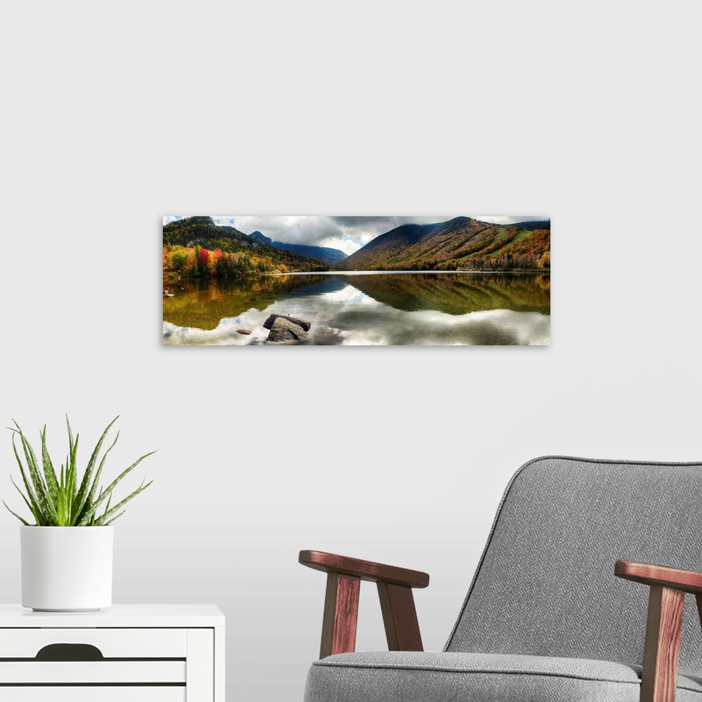 A modern room featuring Fine art photo of mountains reflected in a lake in New Hampshire in autumn.