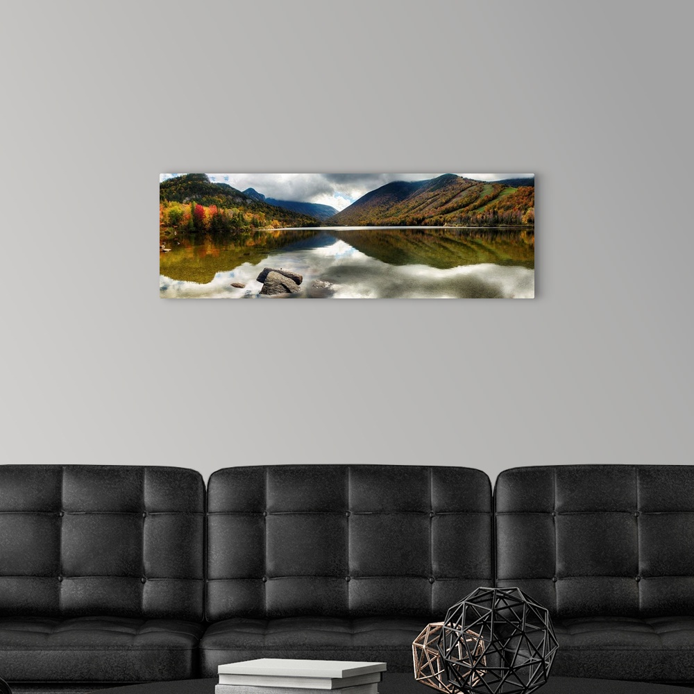 A modern room featuring Fine art photo of mountains reflected in a lake in New Hampshire in autumn.