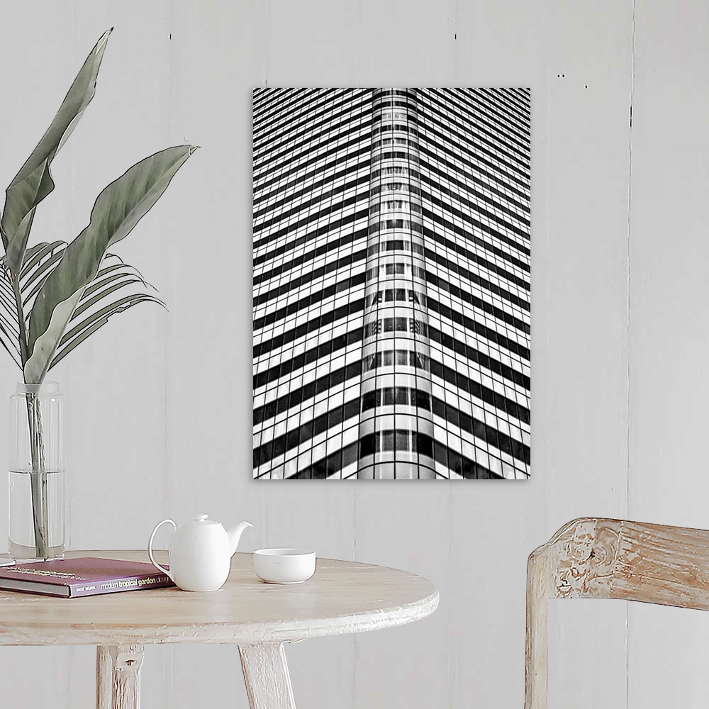 A farmhouse room featuring A black and white photograph of an abstract view of a skyscraper.