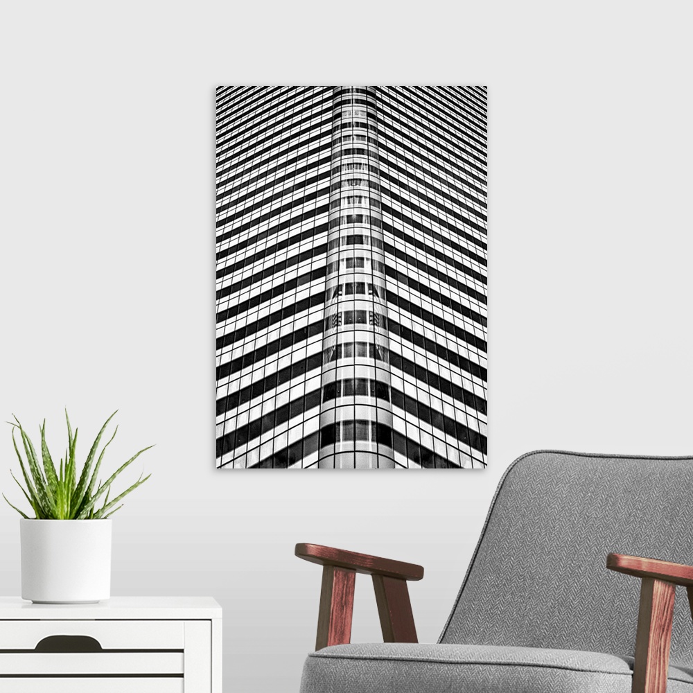 A modern room featuring A black and white photograph of an abstract view of a skyscraper.