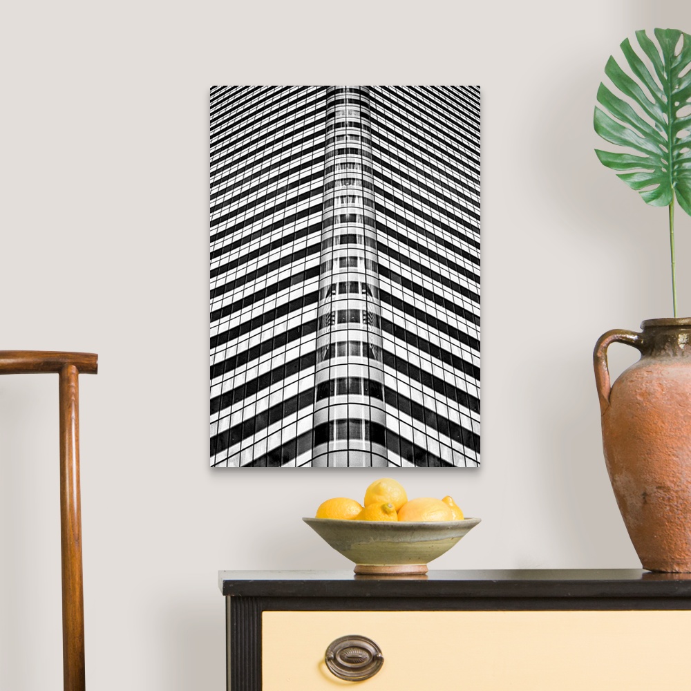 A traditional room featuring A black and white photograph of an abstract view of a skyscraper.