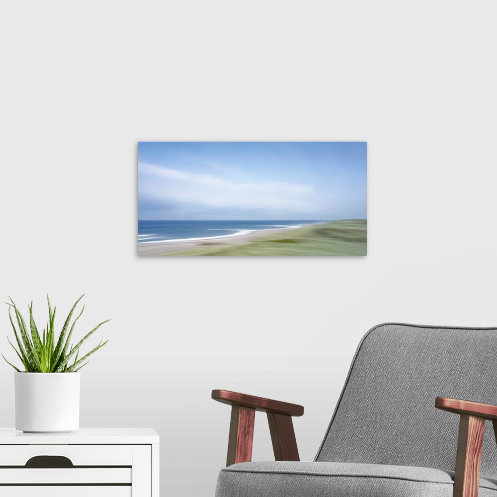 A modern room featuring Artistically blurred photo. Strong winds from the sea climb restlessly over the dunes.