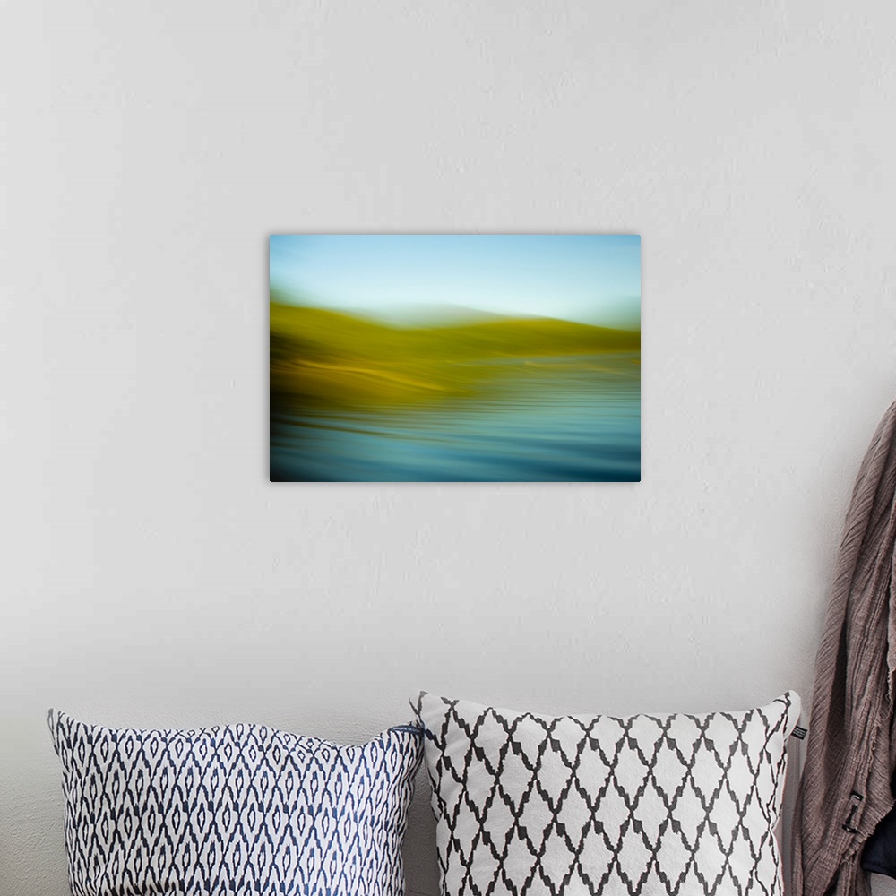 A bohemian room featuring An abstract ocean scene of the water rhythmically flowing onto the gold beach.