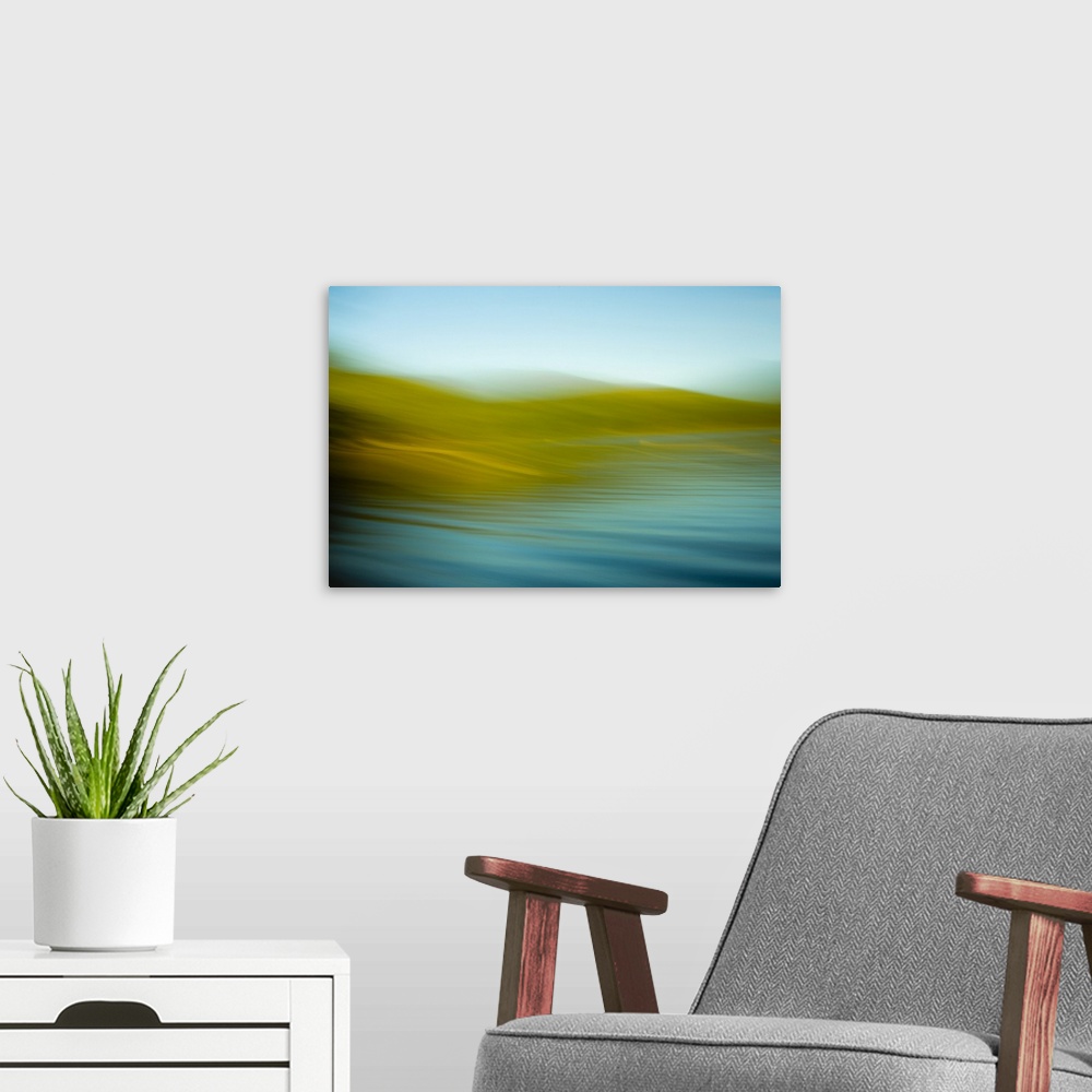 A modern room featuring An abstract ocean scene of the water rhythmically flowing onto the gold beach.