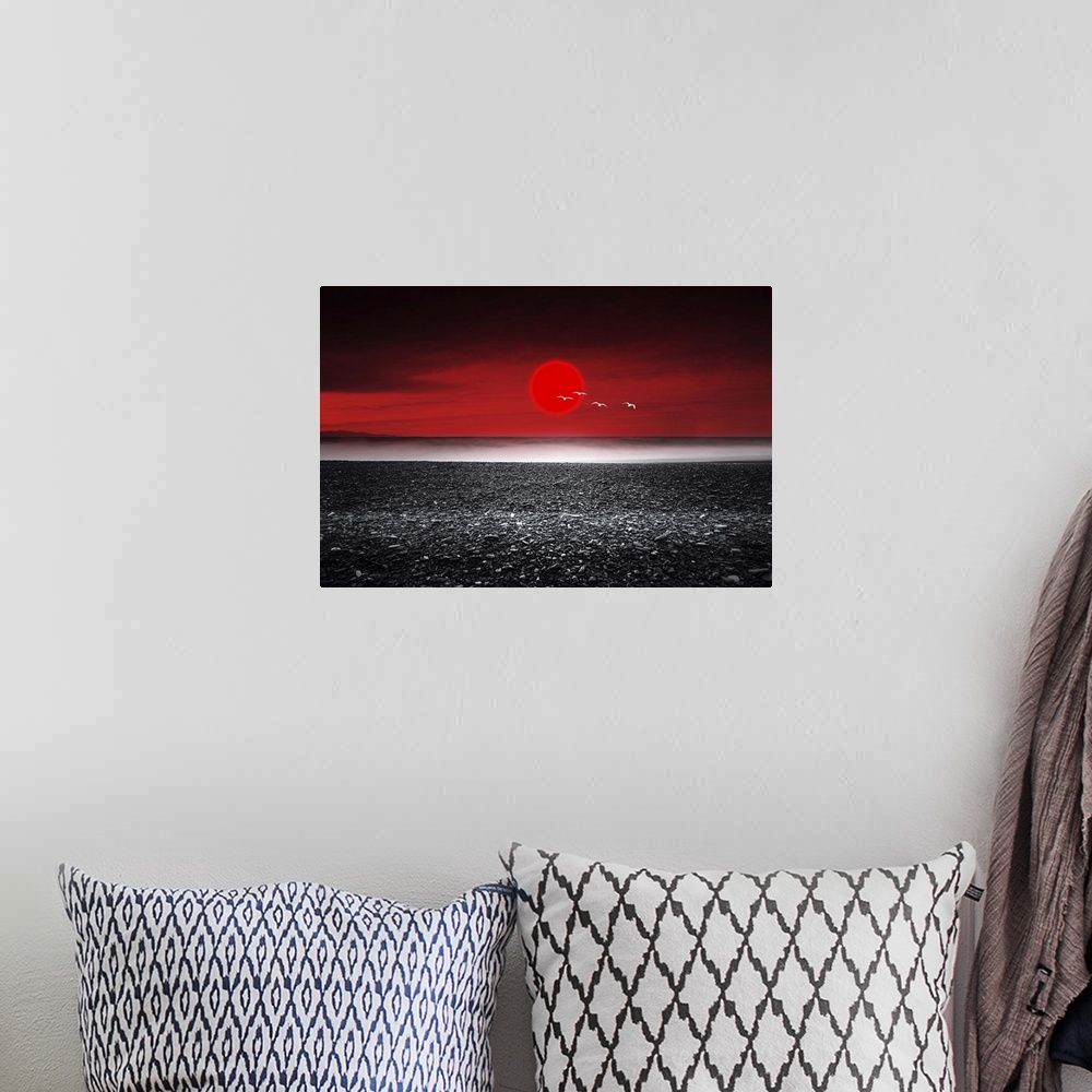 A bohemian room featuring Red sunset over a black sand beach