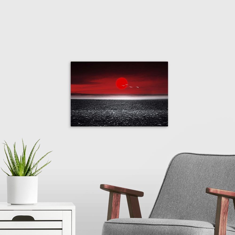 A modern room featuring Red sunset over a black sand beach