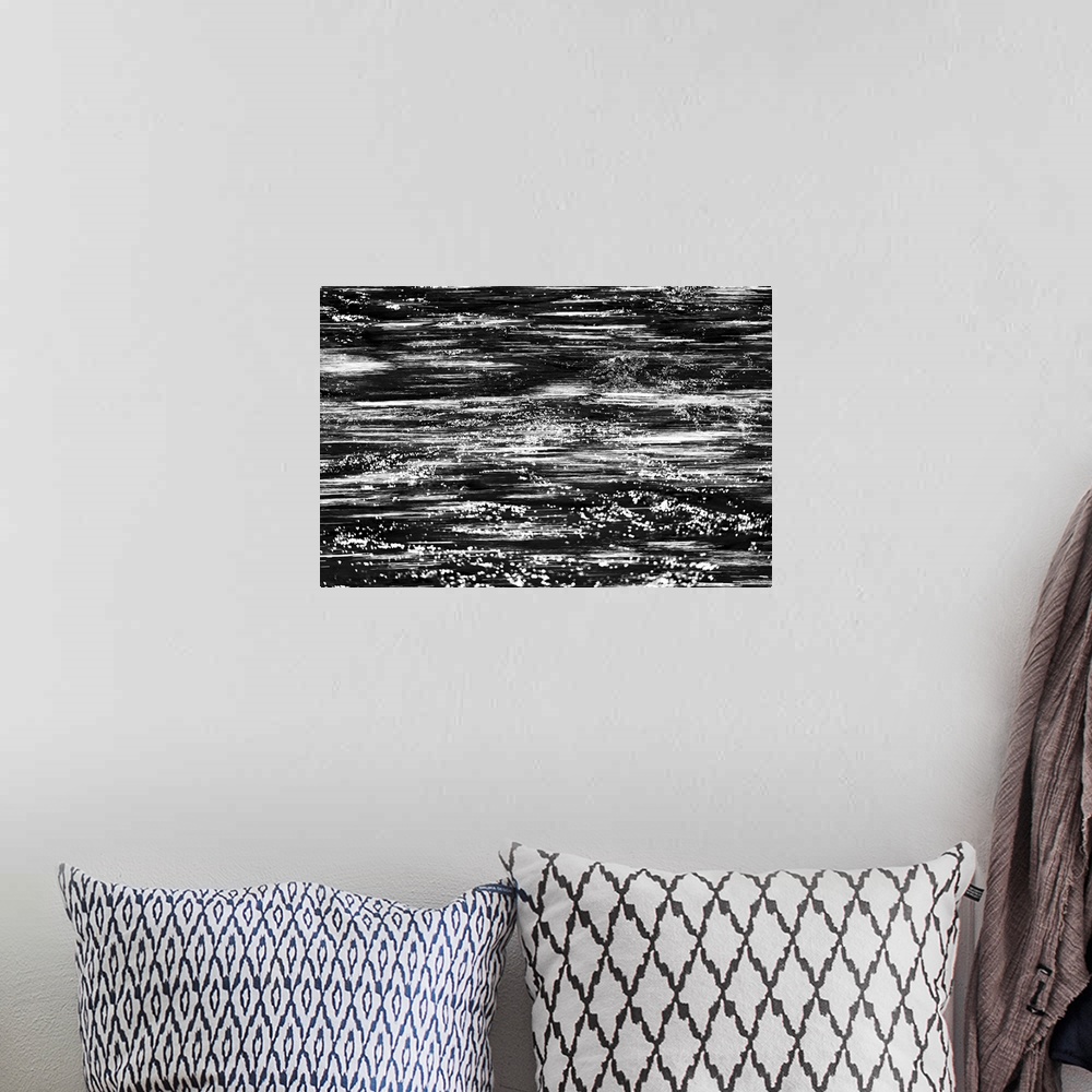A bohemian room featuring Black and white abstract image of rushing water in a river.